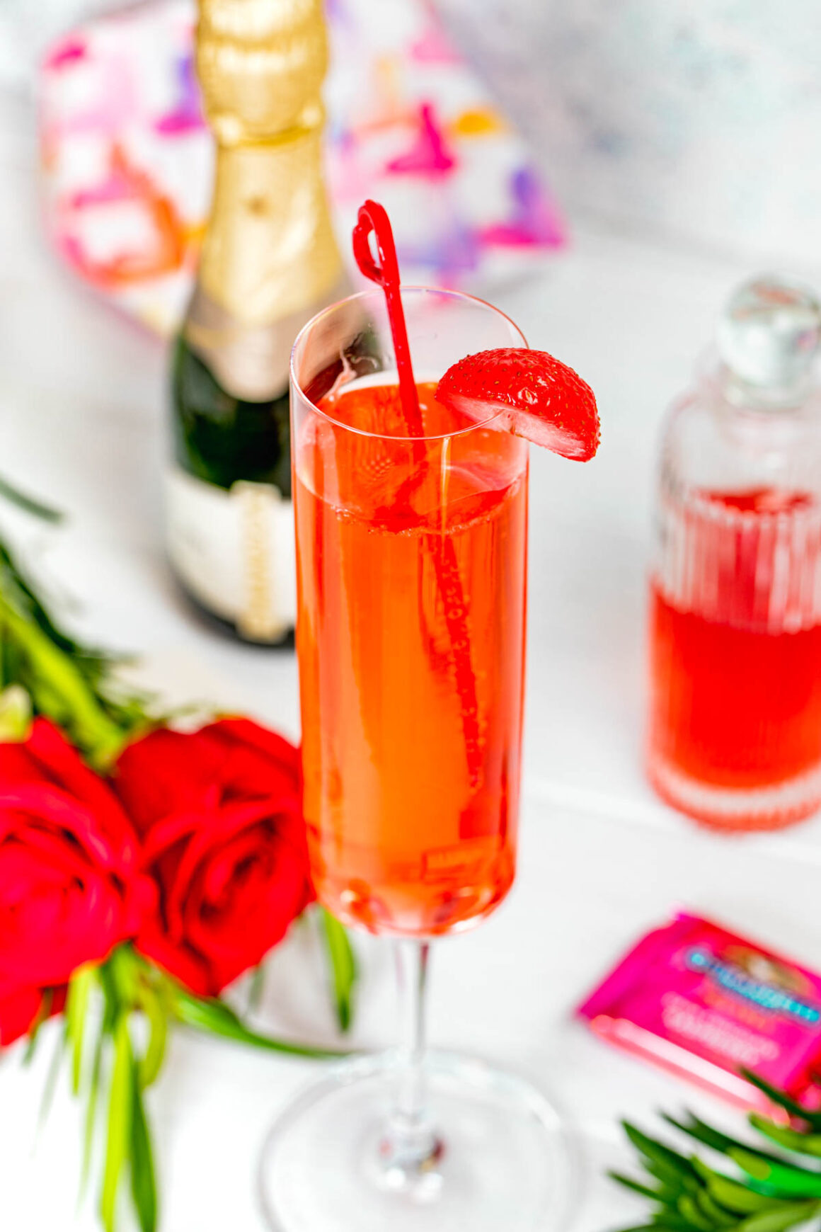 strawberry crush cocktail served into a champagne glass