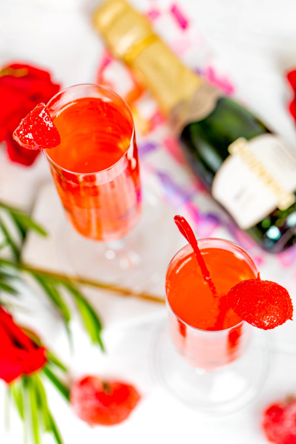 aerial view for 2 glasses of champagne with strawberry flavor drink