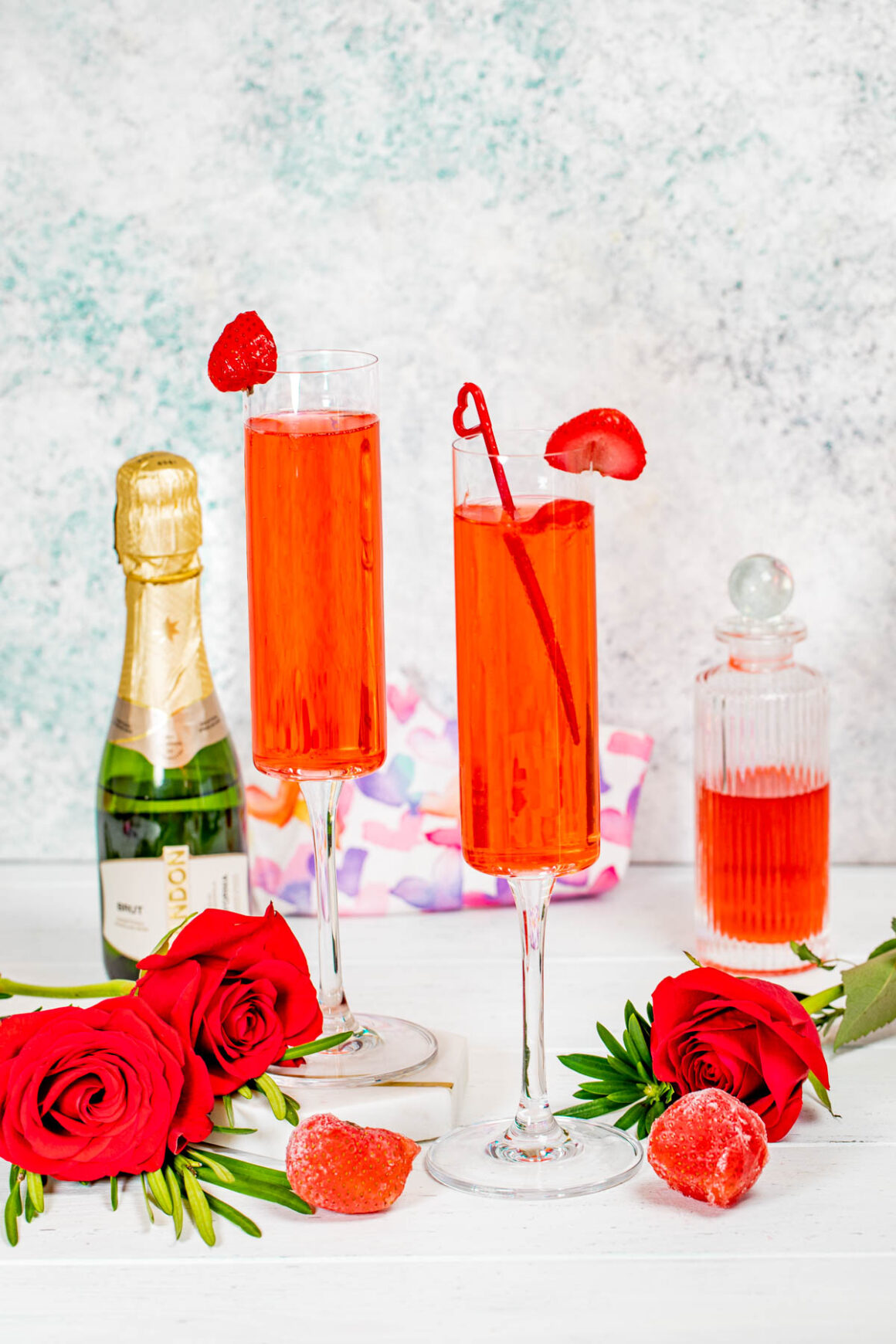 strawberry crush cocktail served into a champagne glasses