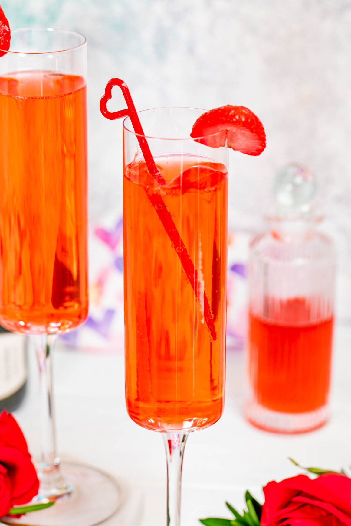 a champgane glass with a straberry drink recipe