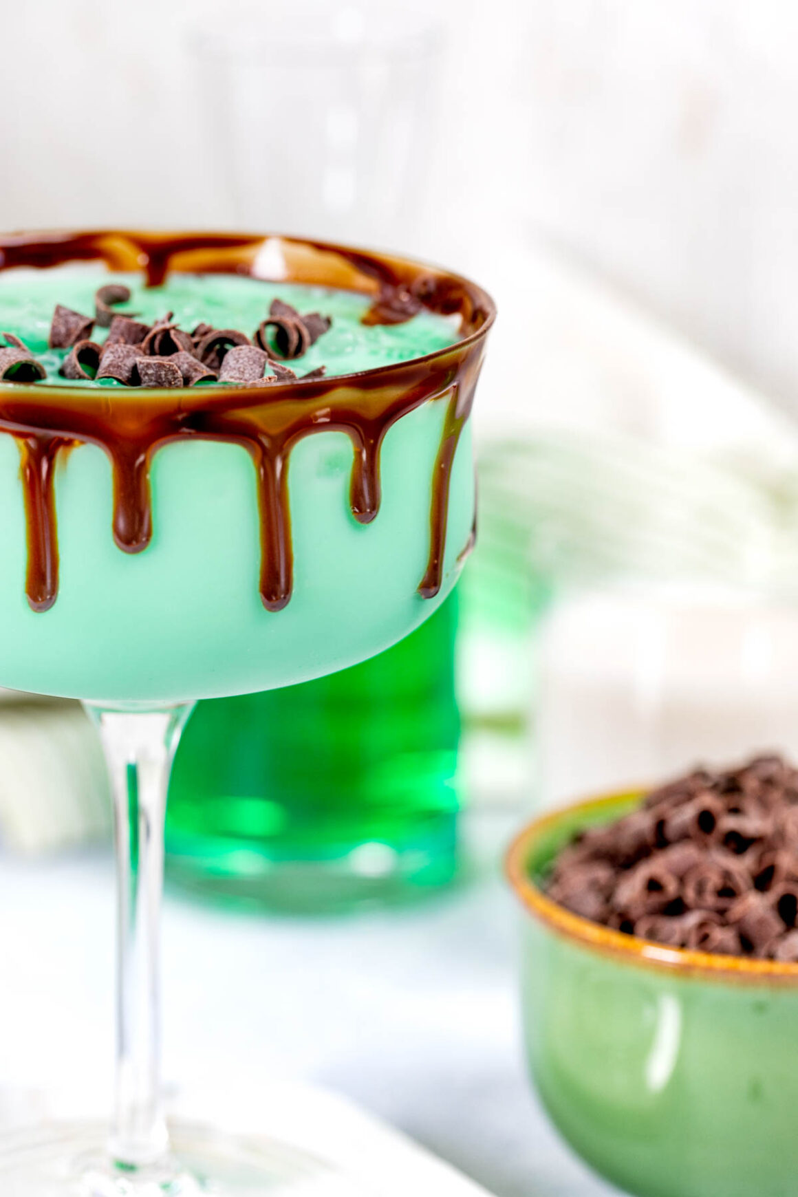 martini glasses with melted chocolate on the rim 
