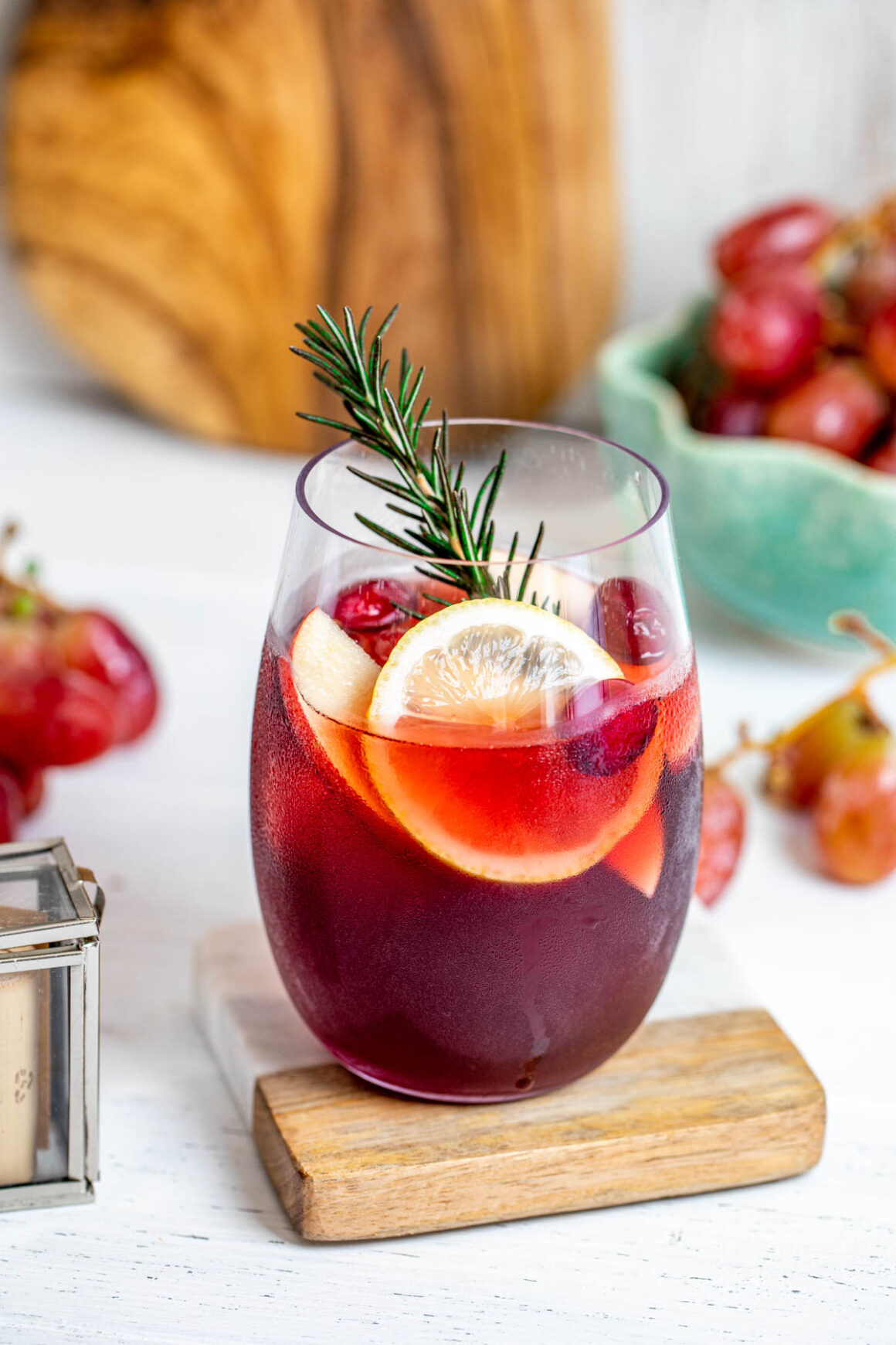 The primary components include red wine, fruits, a sweetener, and a spirit. 
