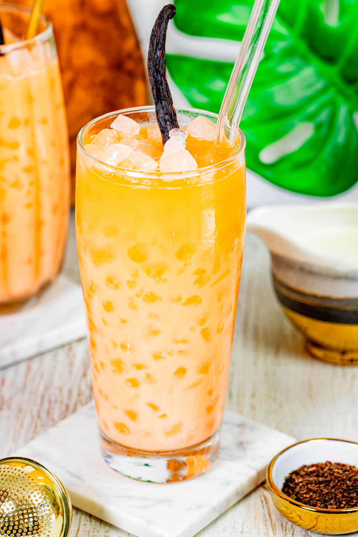 orange tea served into a tall glass
