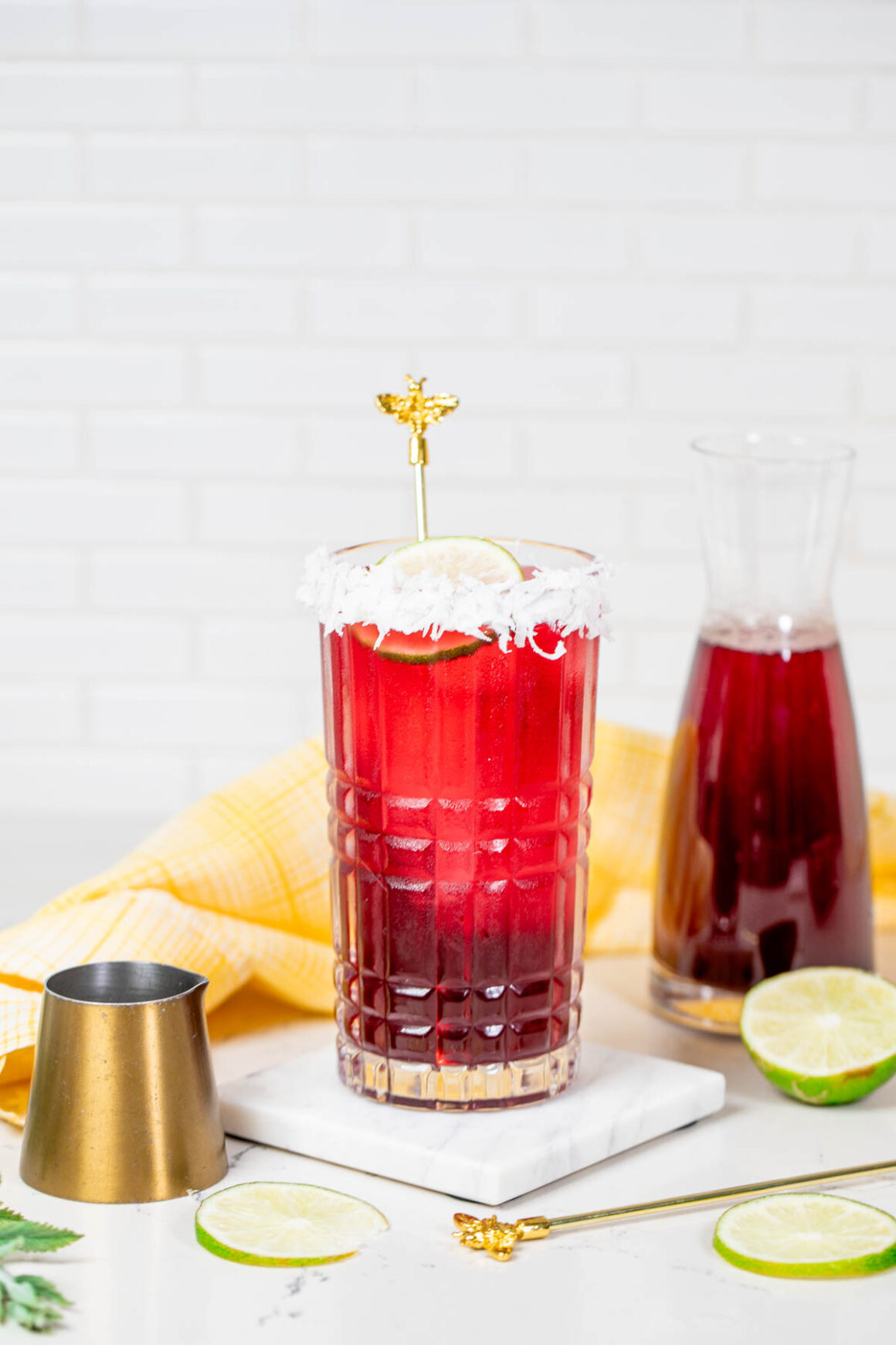 beet recipe served into a tall glass rim it with shredded coconut as a garnish