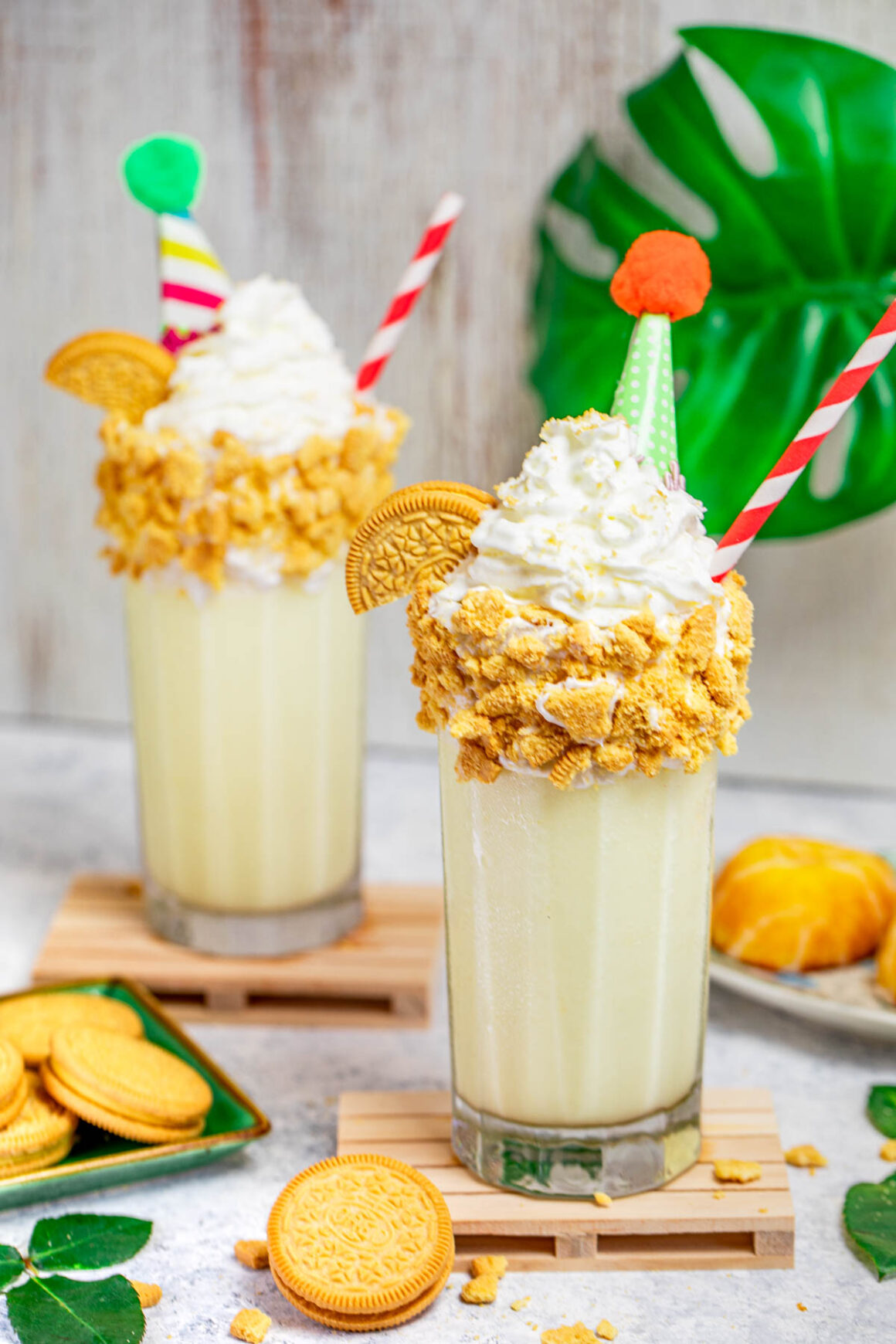 2 lemon pie smoothies with a party hats like a decorations
