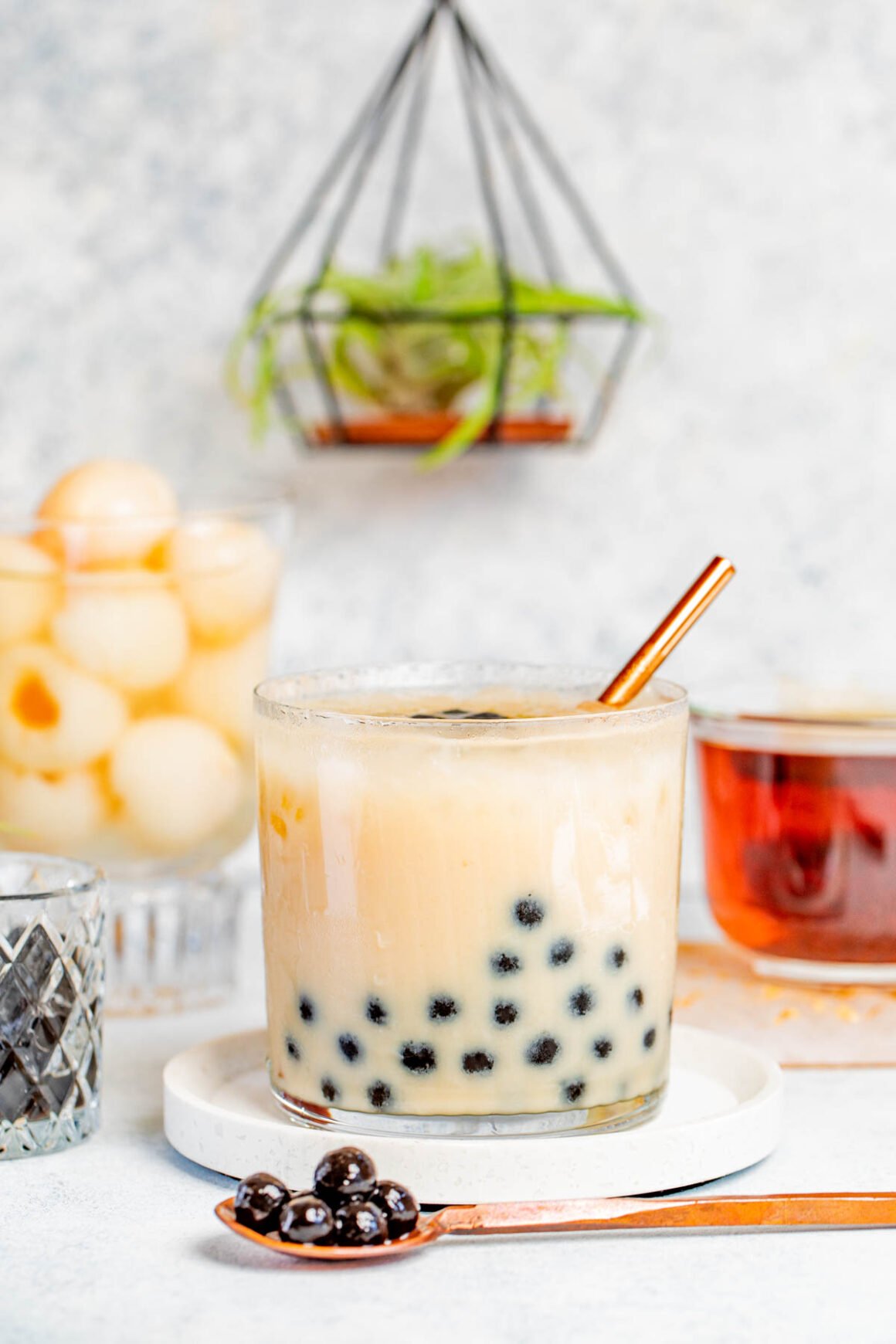 one old fashioned glass with lychee boba tea 