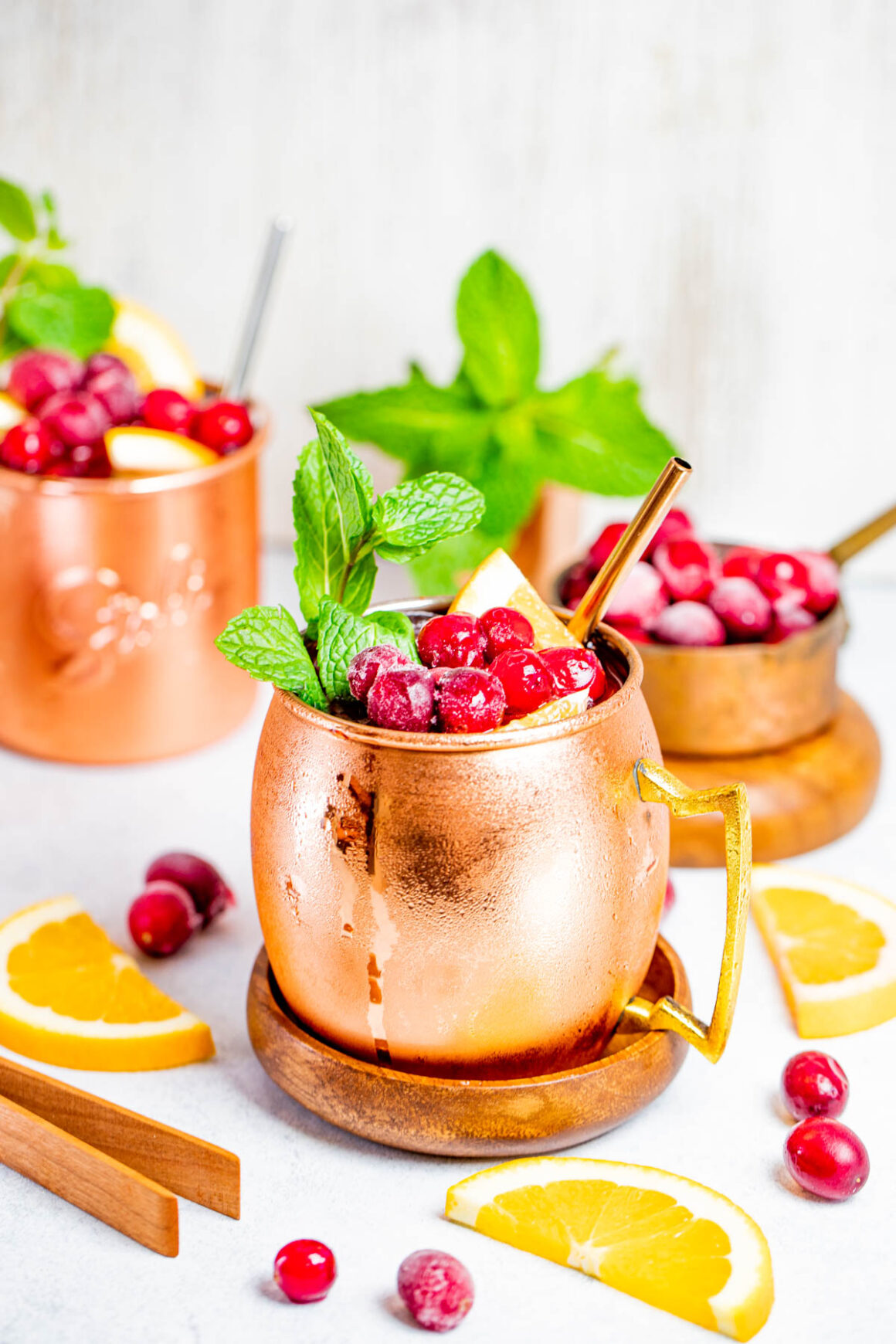 2 cranberry moscow mules served in a copper mugs 