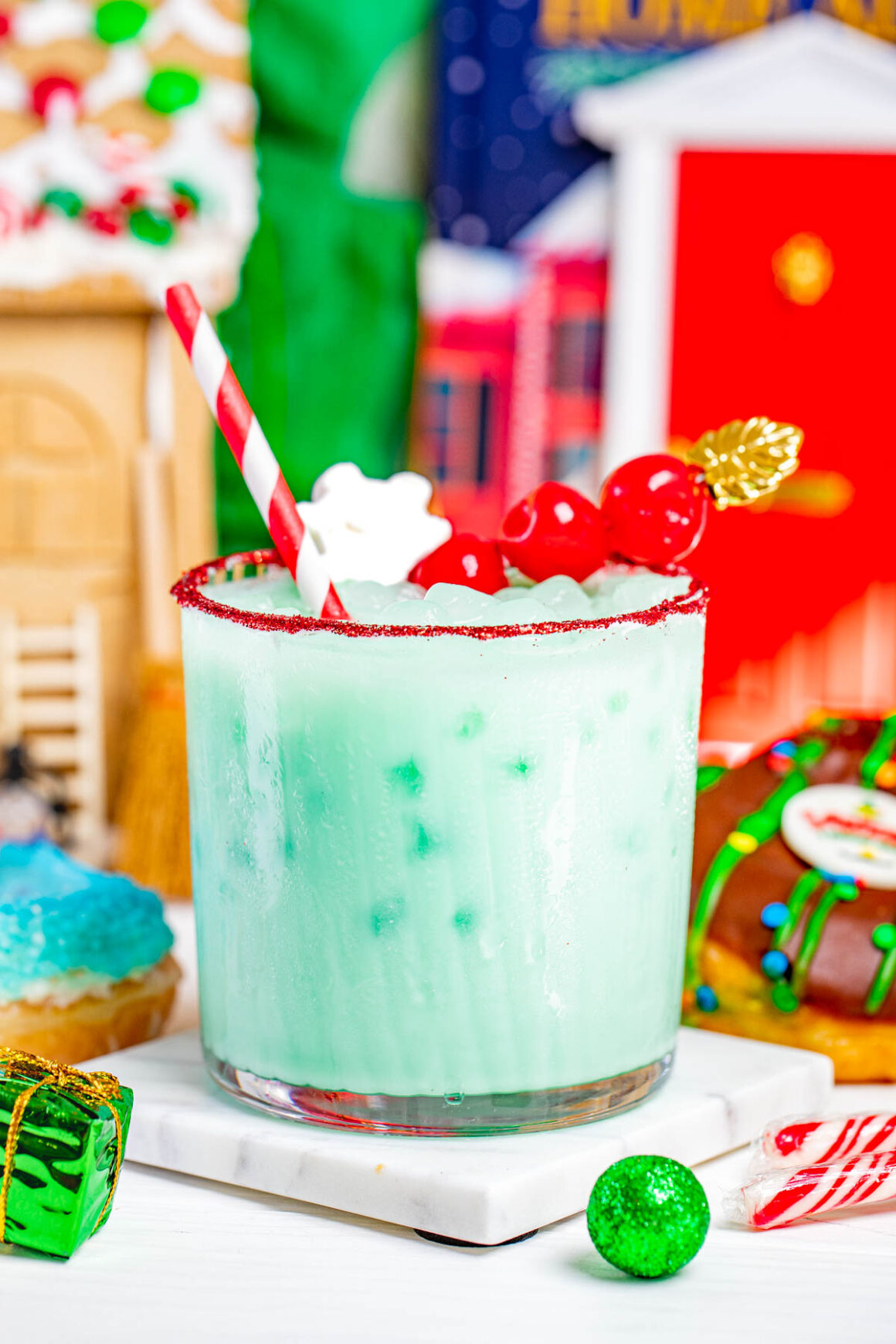 grinch cocktail recipe with christmas background