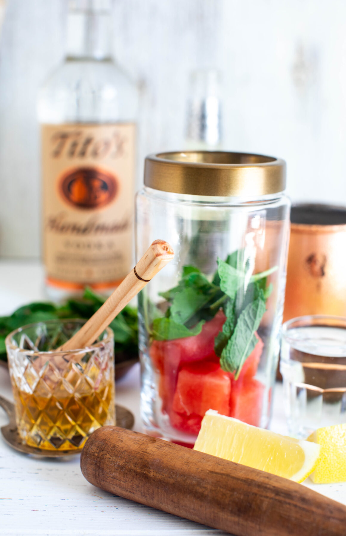 cocktail shaker with ingredients to make watermelon moscow mule 