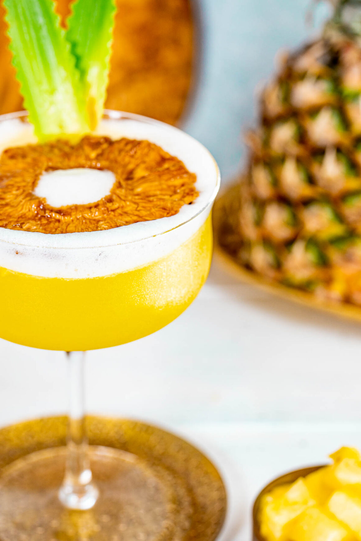 close up of a yellow martini flavored pineapple