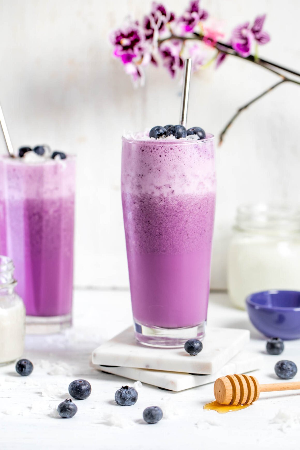 2 blueberry smoothie with a purple color 