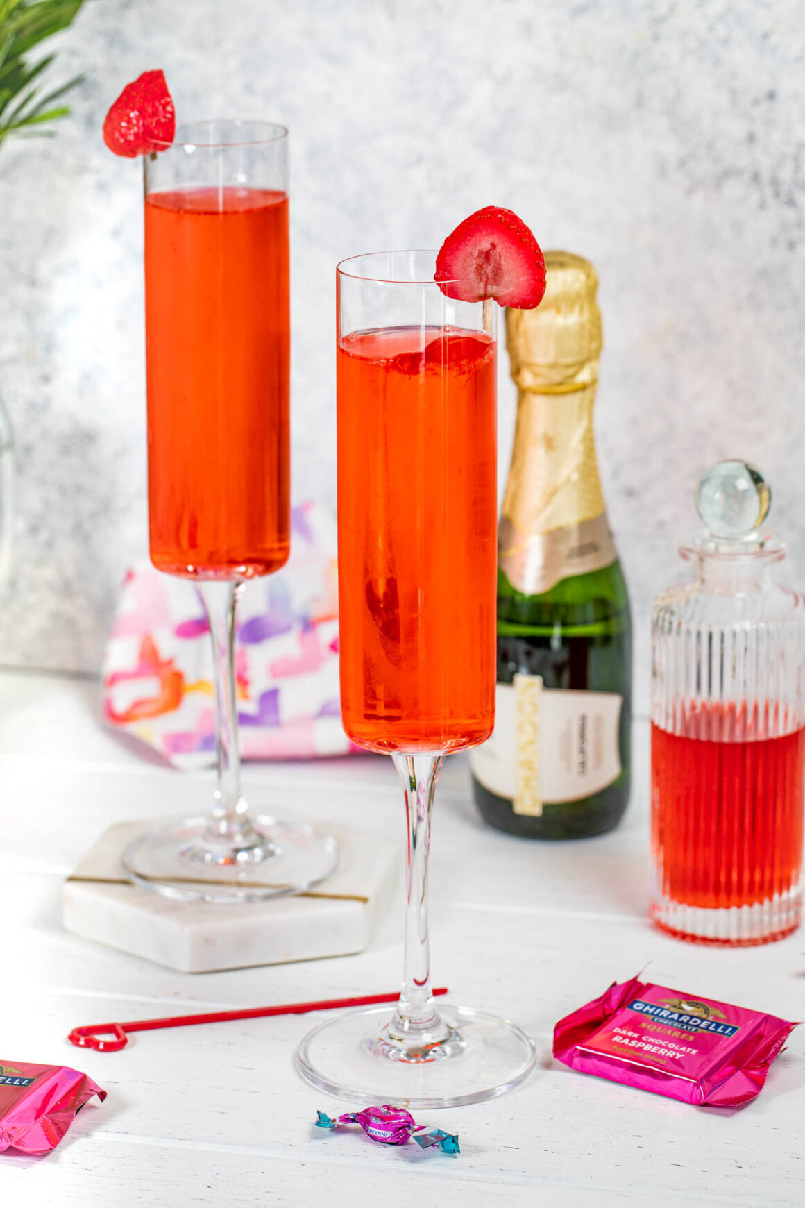 elegant champagne glasses with a strawberry crush cocktail 